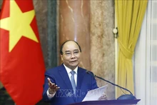 Chủ tịch nước Nguyễn Xuân Phúc phát biểu tại buổi gặp mặt. (Ảnh: Thống Nhất/TTXVN)