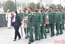 Ngày 6/1/2022, tại Nghĩa trang liệt sĩ Tông Khao, UBND tỉnh Điện Biên tổ chức trọng thể lễ truy điệu và an táng 6 hài cốt liệt sĩ quân tình nguyện Việt Nam hy sinh tại Lào trong thời kỳ kháng chiến. (Ảnh: Lan Nga)