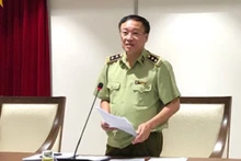 Phó Cục trưởng Cục QLTT Hà Nội Nguyễn Minh Hùng thông tin tại hội nghị giao ban báo chí chiều 8-9.
