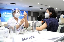TP Hồ Chí Minh huy động các lực lượng triển khai tiêm chủng trên diện rộng. (Ảnh: TTXVN).