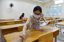 Cán bộ làm công tác thi tại Kỳ thi tốt nghiệp THPT 2020. Ảnh: THUỶ NGUYÊN