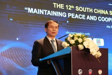 Đồng chí Bùi Thanh Sơn phát biểu chào mừng Hội thảo. (Ảnh: Bộ Ngoại giao Việt Nam)