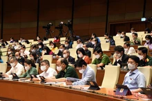 Đại biểu Quốc hội nghe các báo cáo quan trọng sáng 22/7. Ảnh: DUY LINH