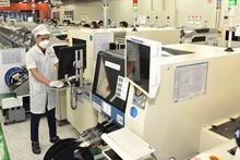 Dây chuyền sản xuất và lắp ráp linh kiện điện tử của Công ty TNHH Samsung Electronics Việt Nam tại Thái Nguyên. (Ảnh: Trần Hải)