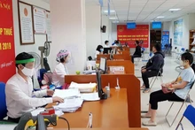 Cục Thuế Hà Nội vừa bảo đảm nhiệm vụ công tác vừa phòng, chống dịch Covid-19. (Ảnh minh họa).