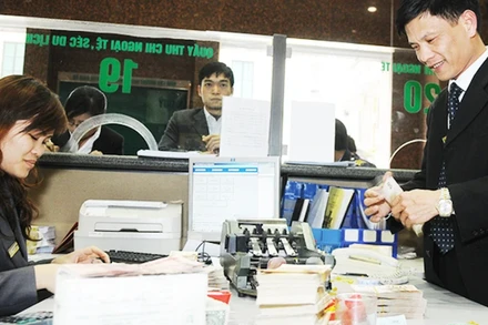 Tỷ giá USD/VND đối mặt với áp lực tăng trong quý I năm nay. (Ảnh: NGUYỄN NAM)