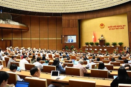 Quốc hội làm việc tại hội trường nghe Tờ trình và Báo cáo dự án Luật sửa đổi, bổ sung một số điều của Luật Doanh nghiệp. (Ảnh: DUY LINH)