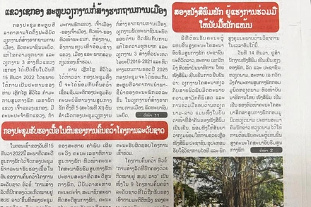 Báo Pasaxon số ra ngày 16/12 đăng trang nhất về kết quả buổi làm việc giữa đồng chí Khamphan Pheuyavong với Tổng Biên tập Báo Nhân Dân Lê Quốc Minh. (Ảnh: Trịnh Dũng)