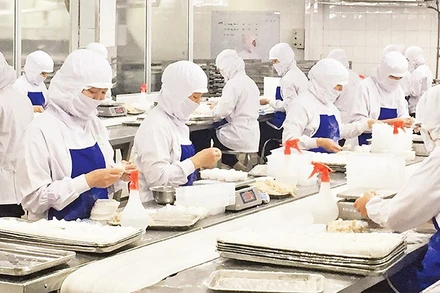 Lao động tại Công ty cổ phần Thực phẩm Agrex Saigon. (Ảnh: Phương Vy)