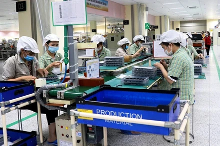 Người lao động làm việc tại khu công nghiệp Quế Võ, Bắc Ninh. (Ảnh: An Trân)