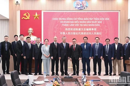 Đoàn Nhân Dân nhật báo đến thăm và làm việc tại trụ sở Báo Nhân Dân vào tháng 3/2025. (Ảnh: BÙI GIANG)