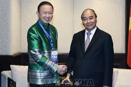 Chủ tịch nước Nguyễn Xuân Phúc tiếp Chủ tịch Hội Hữu nghị Việt Nam-Thái Lan Sanan Angubolkul. (Ảnh: TTXVN)