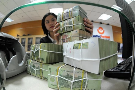 Hoàn thiện hành lang pháp lý cho xử lý nợ xấu. (Ảnh: TRẦN HẢI)