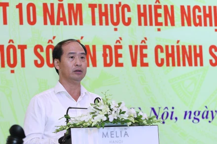 Thứ trưởng Lao động–Thương binh và Xã hội Nguyễn Văn Hồi phát biểu tại hội thảo.