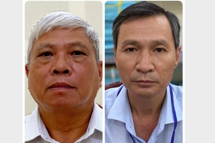 Các bị can Đặng Quang Việt và Nguyễn Thành Nhân (từ trái qua phải).