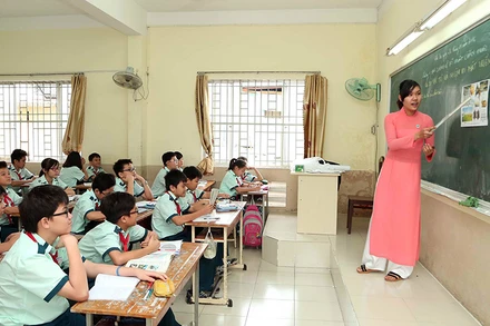 Cùng với việc nâng cao chuyên môn, nghiệp vụ, thầy cô cần giữ gìn đạo đức nhà giáo. Trong ảnh: Giờ học của cô trò Trường THCS Thanh Hà, huyện Thanh Ba, tỉnh Phú Thọ. (Ảnh TUẤN TRUNG)