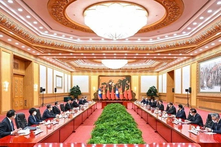 Hội đàm giữa Tổng Bí thư, Chủ tịch Trung Quốc Tập Cận Bình và Tổng Bí thư, Chủ tịch nước Lào Thongloun Sisoulith. (Ảnh: Tân Hoa Xã)