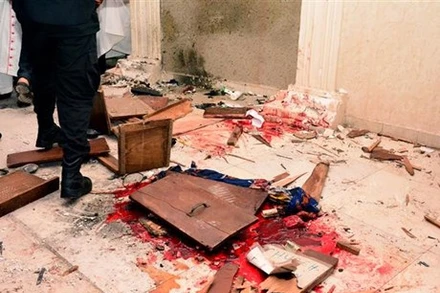 Hiện trường một vụ tấn công ở thị trấn Owo, Tây Nam Nigeria, hồi năm ngoái. (Ảnh: AFP/TTXVN)