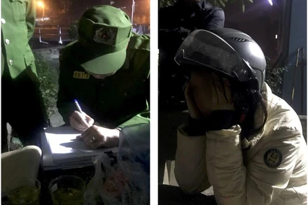 Người phụ nữ trẻ (bên phải) có ý định tự vẫn được công nhân thoát nước ngăn chặn kịp thời.