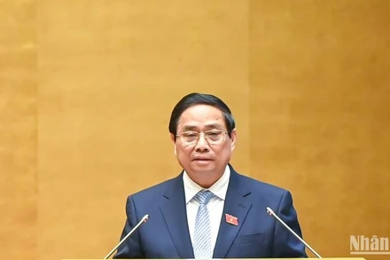 Thủ tướng Phạm Minh Chính trình bày Báo cáo của Chính phủ tại phiên khai mạc Kỳ họp. (Ảnh: DUY LINH)