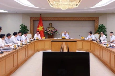 Phó Thủ tướng Thường trực Chính phủ Nguyễn Hòa Bình chủ trì cuộc họp. (Ảnh: TTXVN)