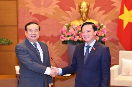 Phó Chủ tịch Quốc hội Nguyễn Khắc Định tiếp Chủ nhiệm Ủy ban Đối ngoại của Quốc hội Lào Sanya Praseuth. (Ảnh: TTXVN)