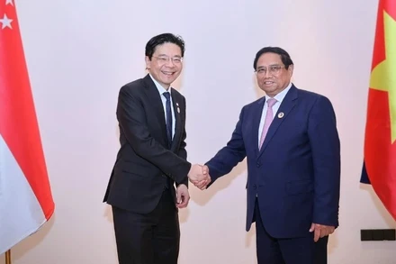 Thủ tướng Chính phủ Phạm Minh Chính và Thủ tướng Singapore Lawrence Wong hội đàm lần đầu tiên trong khuôn khổ cuộc gặp thường niên giữa hai Thủ tướng, nhân dịp dự Hội nghị Cấp cao ASEAN 44, 45, tháng 10/2024. (Ảnh: VGP)