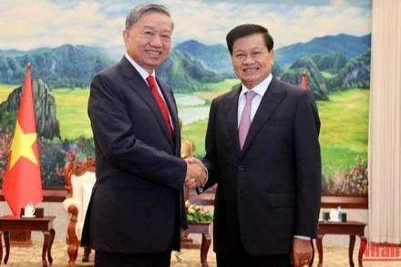 Tổng Bí thư, Chủ tịch nước Lào Thongloun Sisoulith và Bộ trưởng Công an Tô Lâm tại buổi tiếp. (Ảnh: Trịnh Quốc Dũng)