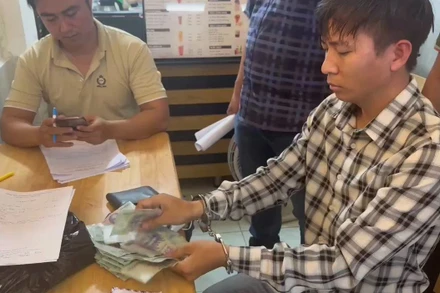 Lê Xuân Đào làm việc với cơ quan chức năng. (Ảnh: Công an cung cấp)