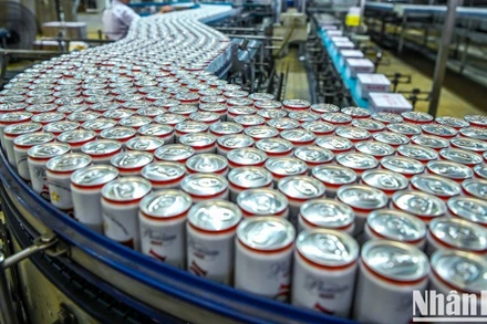 Dây chuyền sản xuất bia lon của một doanh nghiệp Việt Nam. (Ảnh: THÀNH ĐẠT).