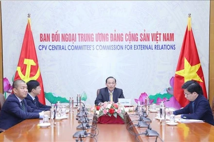 Quang cảnh buổi điện đàm. (Ảnh: TTXVN)