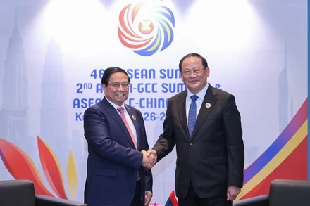 Thủ tướng Phạm Minh Chính và Thủ tướng Lào Sonexay Siphandone. (Ảnh: VGP/Nhật Bắc)