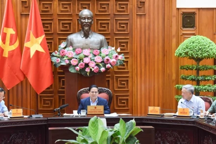 Thủ tướng Phạm Minh Chính chủ trì cuộc họp của Thường trực Chính phủ về phát triển trung tâm tài chính quốc tế (Ảnh: TRẦN HẢI). 