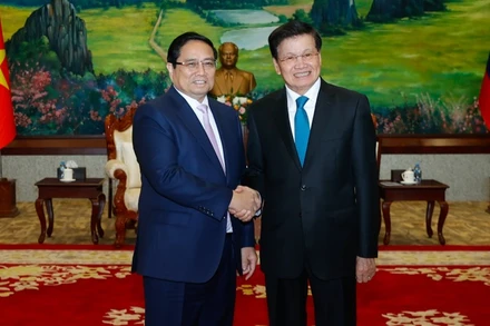 Thủ tướng Phạm Minh Chính và Tổng Bí thư, Chủ tịch nước Lào Thongloun Sisoulith. (Ảnh: THANH GIANG)