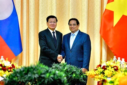 Thủ tướng Chính phủ Phạm Minh Chính và Tổng Bí thư, Chủ tịch nước Lào Thongloun Sisoulith. (Ảnh: THANH GIANG)