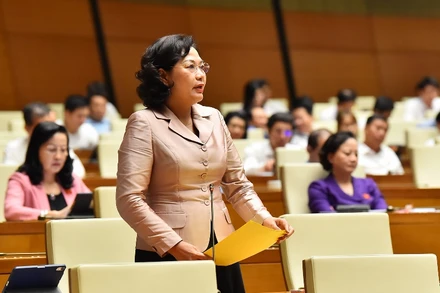 Thống đốc Ngân hàng Nhà nước Nguyễn Thị Hồng giải trình, làm rõ một số nội dung đại biểu Quốc hội nêu tại phiên thảo luận. (Ảnh: THỦY NGUYÊN)