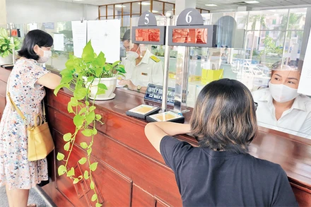 Người nộp thuế được hướng dẫn thủ tục thuế tại Cục Thuế Thành phố Hồ Chí Minh. (Ảnh CTV)