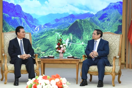 Thủ tướng Phạm Minh Chính và đồng chí Phet Phomphiphak, Bộ trưởng Bộ Kế hoạch và Đầu tư Lào, Chủ tịch Ủy ban hợp tác Lào-Việt Nam.