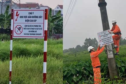EVNHANOI lắp đặt hệ thống biển cảnh báo bảo vệ hành lang an toàn lưới điện. 