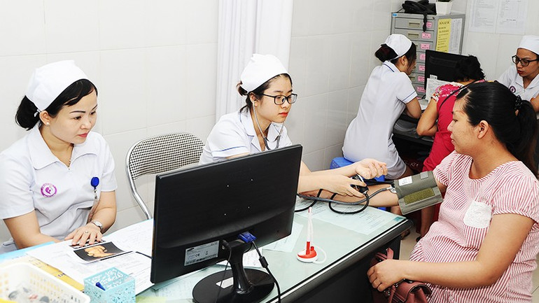 Thực hiện bệnh án điện tử sẽ giảm thời gian chờ đợi khám, chữa bệnh cho bệnh nhân. Ảnh: Nam ANh 32.jpg