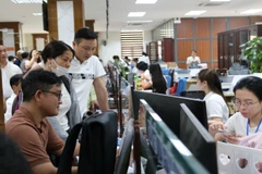 Người dân, doanh nghiệp đến giải quyết thủ tục hành chính tại Trung tâm phục vụ hành chính công phường Thành Vinh, tỉnh Nghệ An.