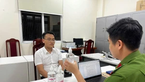 Ông Phạm Đình Tuấn tại cơ quan Công an.