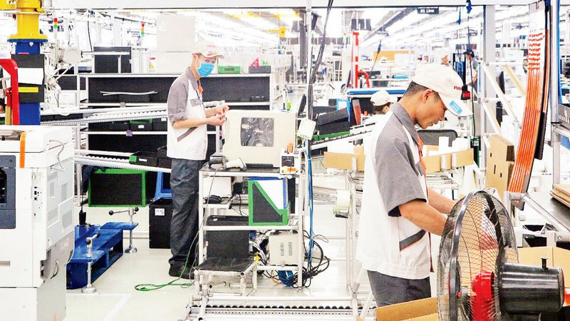 Lao động tham gia sản xuất tại khu công nghiệp VSIP Hải Phòng. (Ảnh: Quang Dũng)