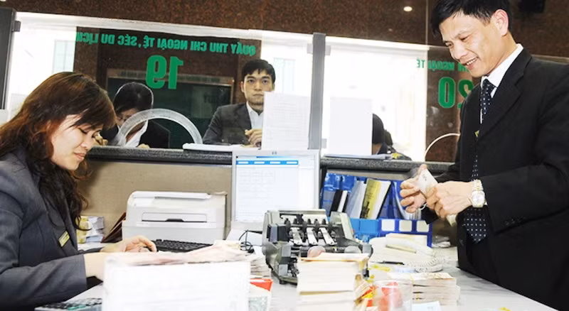 Tỷ giá USD/VND đối mặt với áp lực tăng trong quý I năm nay. (Ảnh: NGUYỄN NAM)