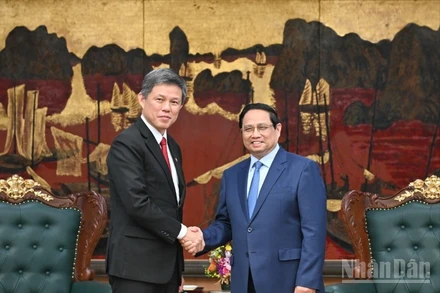 Thủ tướng Phạm Minh Chính và Phó Tổng Thư ký Đảng Nhân dân hành động Singapore. (Ảnh: Trần Hải)