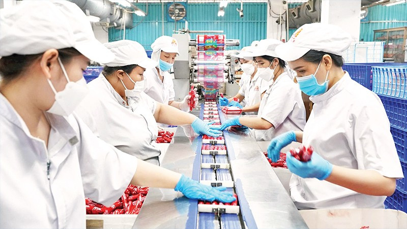 Sản xuất xúc xích phục vụ mùa Tết tại Công ty cổ phần Việt Nam Kỹ nghệ Súc sản-VISSAN. (Ảnh CTV)