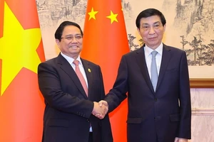 Thủ tướng Phạm Minh Chính hội kiến Chủ tịch Chính hiệp toàn quốc Trung Quốc - Ảnh: VGP/Nhật Bắc