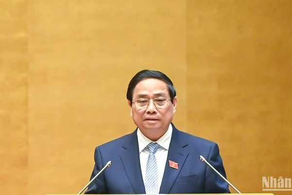 Thủ tướng Phạm Minh Chính trình bày Báo cáo của Chính phủ tại phiên khai mạc Kỳ họp. (Ảnh: DUY LINH)