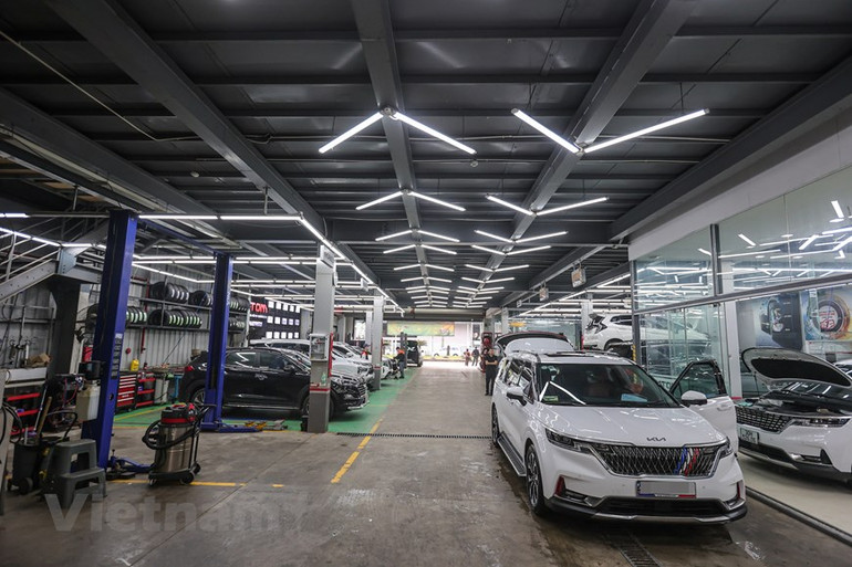 [Ảnh] Dân Hà Nội chi tiền triệu "làm đẹp" ô-tô đón tết Nguyên đán ảnh 1