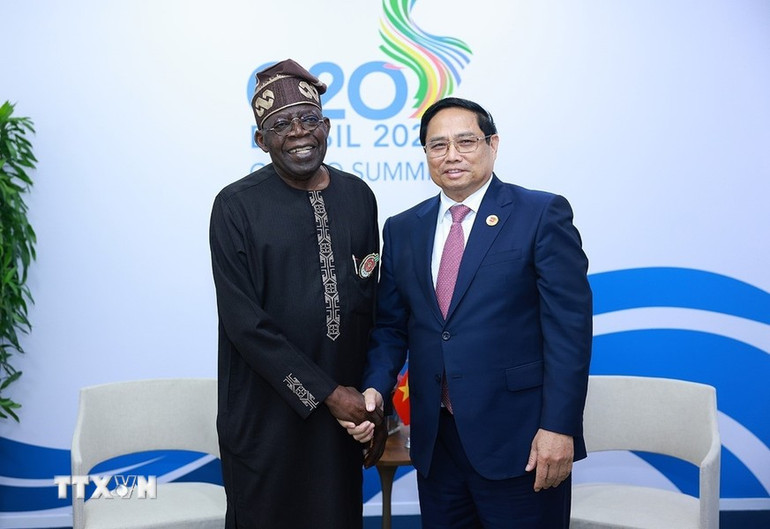 Thủ tướng Phạm Minh Chính gặp Tổng thống Nigeria Bola Ahmed Tinubu. Thủ tướng Phạm Minh Chính gặp Tổng thống Nigeria Bola Ahmed Tinubu.